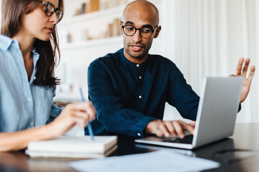 Business man discussing with his colleague in an office